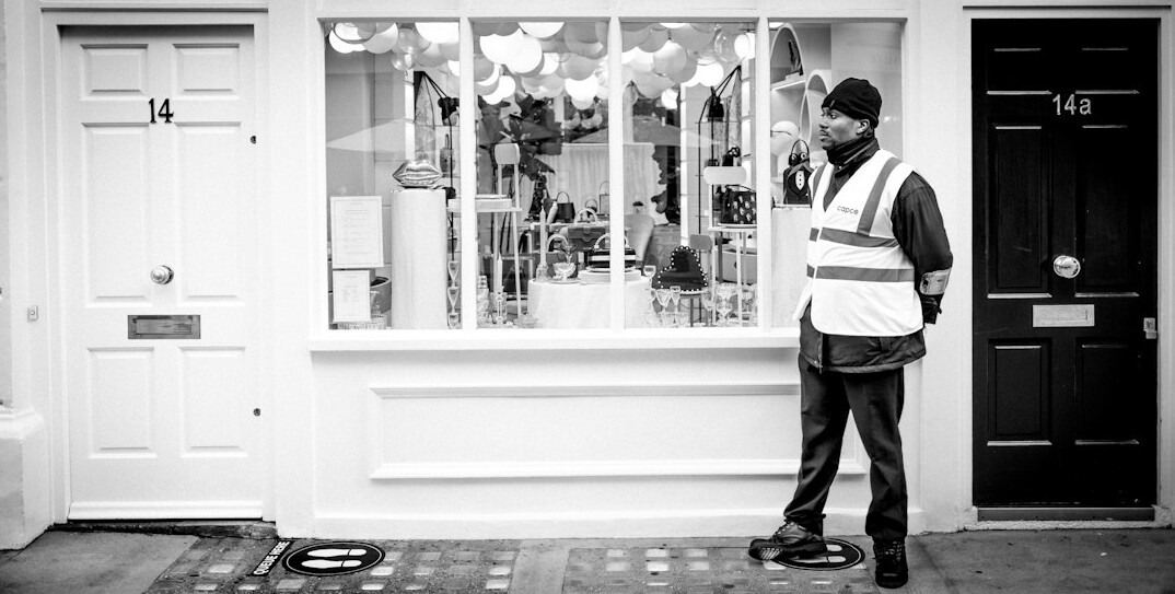store detective watching customer